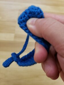 Fidgeting with blue fidget bracelet