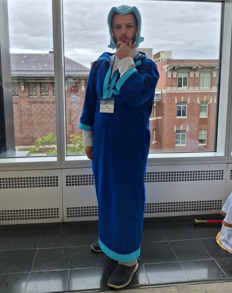 Ferdinand from Ascendance of a Bookworm by the window looking directly at the camera.